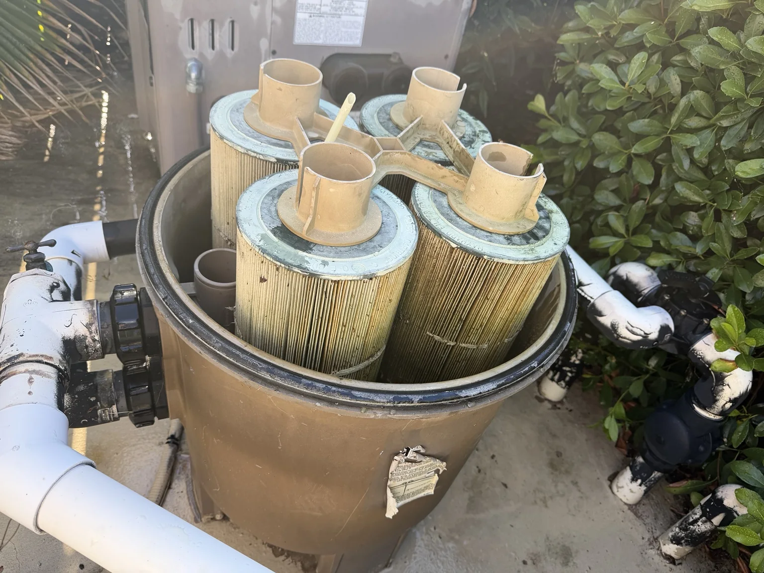 Dirty used pool filter cartridges before replacement